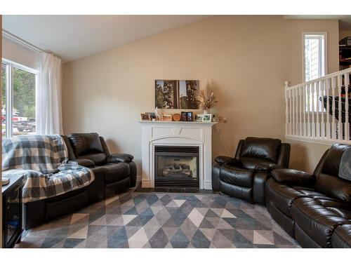 1512 Fir Crescent, Golden, BC - Indoor Photo Showing Living Room With Fireplace