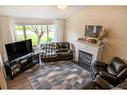 1512 Fir Crescent, Golden, BC  - Indoor Photo Showing Living Room With Fireplace 