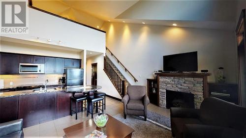 700 Bighorn Boulevard Unit# 735 C, Radium Hot Springs, BC - Indoor Photo Showing Living Room With Fireplace