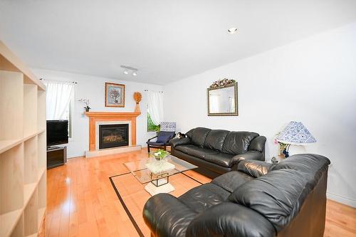 543 John Street N, Hamilton, ON - Indoor Photo Showing Living Room With Fireplace