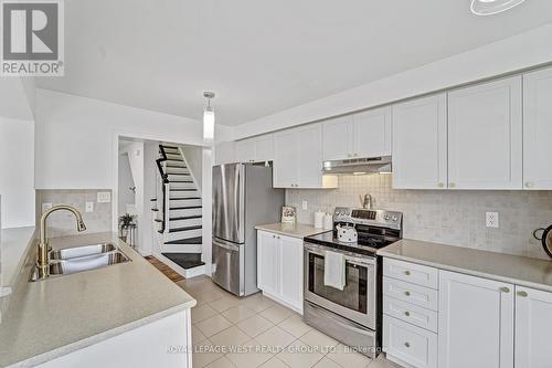 551 Pharo Point, Milton, ON - Indoor Photo Showing Kitchen With Double Sink