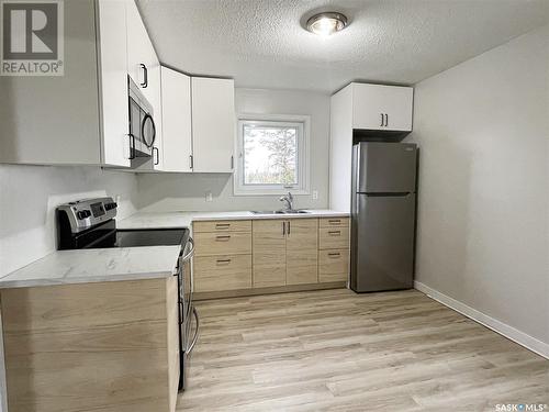 108 Main Street W, Dorintosh, SK - Indoor Photo Showing Kitchen With Double Sink