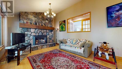 26 Evans Drive, Kawartha Lakes, ON - Indoor Photo Showing Living Room With Fireplace