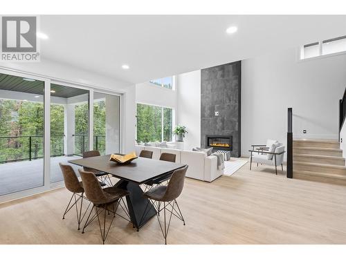 1528 Cabernet Way, West Kelowna, BC - Indoor Photo Showing Dining Room With Fireplace