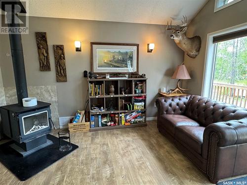 2 307 Birch Street, Lac La Ronge, SK - Indoor Photo Showing Living Room With Fireplace