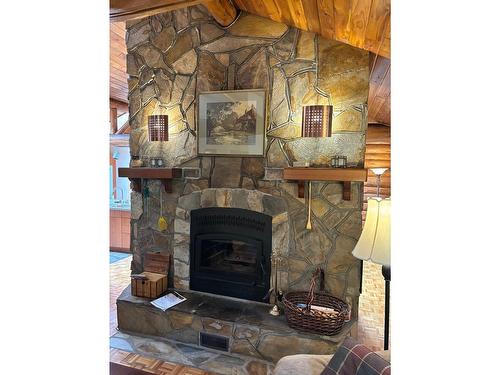 1980 Snowball Creek Road, Grand Forks, BC - Indoor Photo Showing Living Room With Fireplace