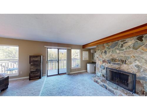 8083 Highway 3/93, Cranbrook, BC - Indoor Photo Showing Living Room With Fireplace