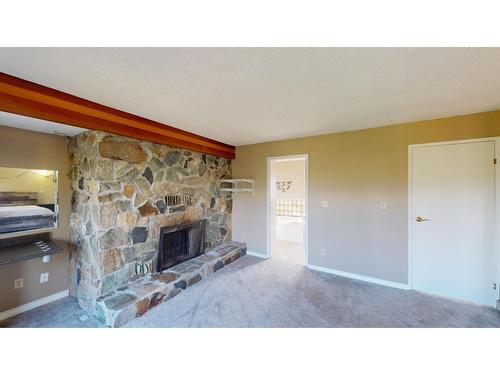 8083 Highway 3/93, Cranbrook, BC - Indoor Photo Showing Living Room With Fireplace