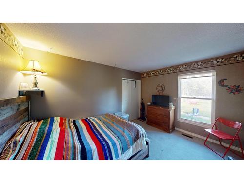 8083 Highway 3/93, Cranbrook, BC - Indoor Photo Showing Bedroom