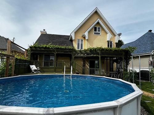 Back facade - 61 Rue Lajoie, Châteauguay, QC - Outdoor With Above Ground Pool