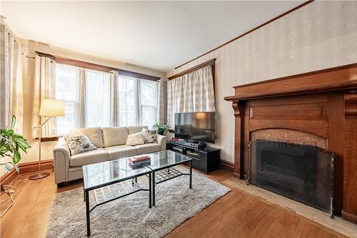 24 Burris Street, Hamilton, ON - Indoor Photo Showing Living Room With Fireplace