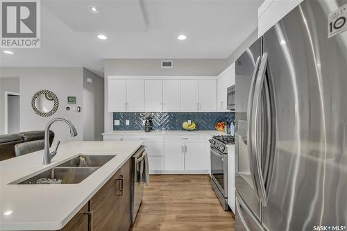 239 Baltzan Boulevard, Saskatoon, SK - Indoor Photo Showing Kitchen With Stainless Steel Kitchen With Double Sink With Upgraded Kitchen