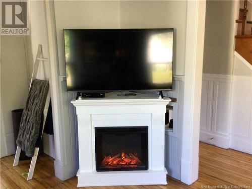 9&11 Hill Street, St. Stephen, NB - Indoor Photo Showing Living Room With Fireplace