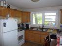 465 Froom Crescent, Regina, SK  - Indoor Photo Showing Kitchen With Double Sink 