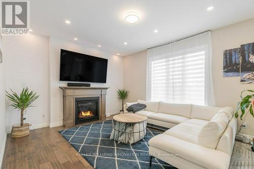 605 Conners Drive, North Perth, ON - Indoor Photo Showing Living Room With Fireplace