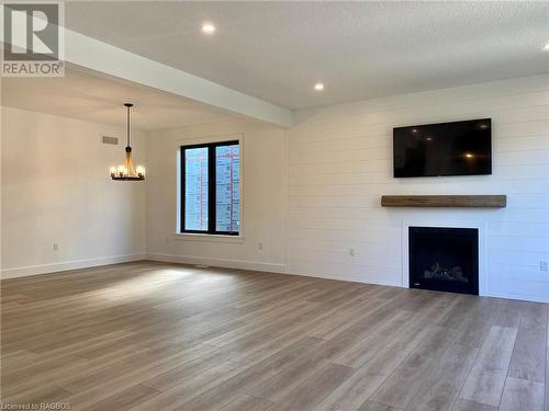 Picture of a Torbay model built in Phase 1 - 27 Lakeforest Drive Unit# Lot 28, Saugeen Shores, ON - Indoor Photo Showing Living Room With Fireplace