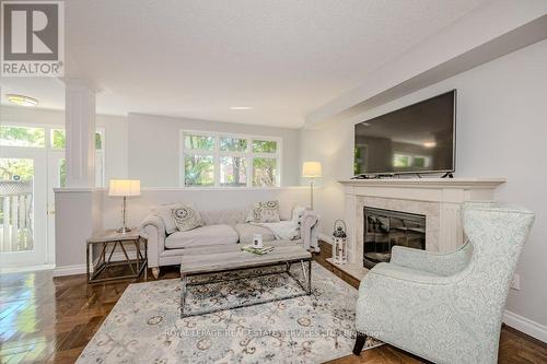 48B - 1084 Queen Street W, Mississauga (Lorne Park), ON - Indoor Photo Showing Living Room With Fireplace