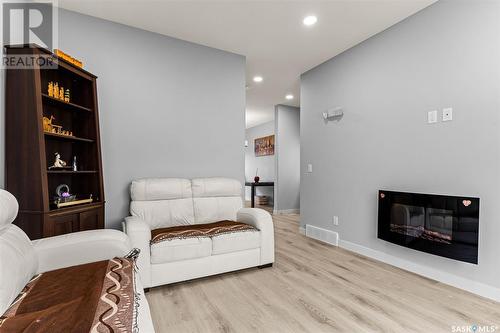 3306 Green Poppy Street, Regina, SK - Indoor Photo Showing Living Room With Fireplace