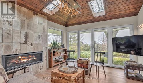 7 Sunrise Court, Cobourg, ON - Indoor Photo Showing Living Room With Fireplace