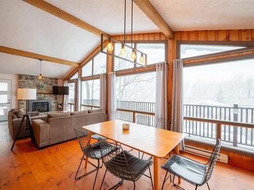 Dinette - 157  - 159 Ch. Bernier, Sutton, QC - Indoor Photo Showing Living Room With Fireplace