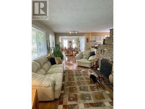 6472 Ewen Road, 100 Mile House, BC - Indoor Photo Showing Living Room With Fireplace