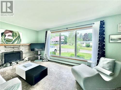 24 Snowball Crescent, Nackawic, NB - Indoor Photo Showing Living Room With Fireplace