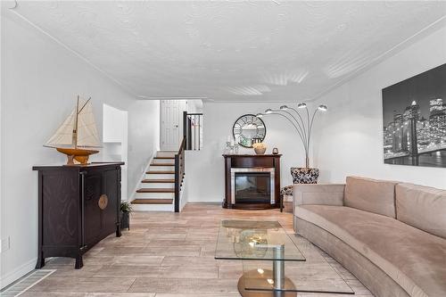 24 Cumberland Street, Brantford, ON - Indoor Photo Showing Living Room With Fireplace