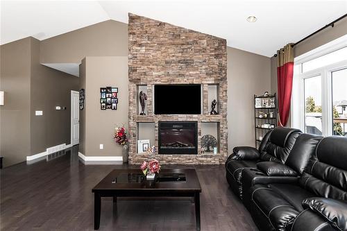 50 Claremont Drive, Niverville, MB - Indoor Photo Showing Living Room With Fireplace