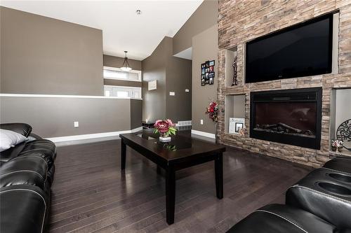 50 Claremont Drive, Niverville, MB - Indoor Photo Showing Living Room With Fireplace