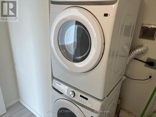 1410 - 3233 Eglinton Avenue E, Toronto, ON - Indoor Photo Showing Laundry Room