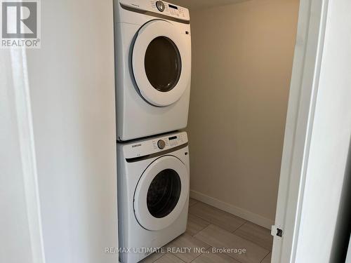 1410 - 3233 Eglinton Avenue E, Toronto, ON - Indoor Photo Showing Laundry Room