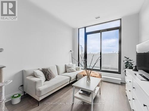 207 - 33 Frederick Todd Way, Toronto, ON - Indoor Photo Showing Living Room