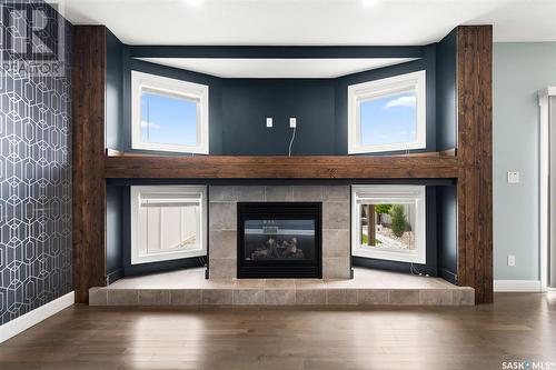 5335 Universal Crescent, Regina, SK - Indoor Photo Showing Living Room With Fireplace