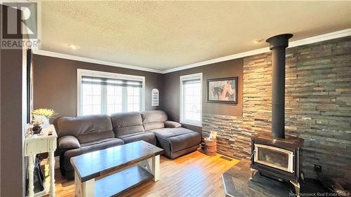 677 Rue Principale, Petit-Rocher, NB - Indoor Photo Showing Living Room With Fireplace