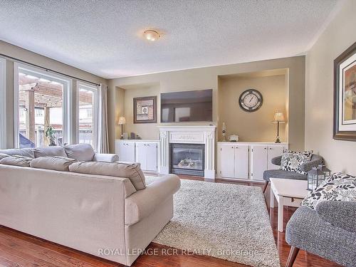 124 Downy Emerald Dr, Bradford West Gwillimbury, ON - Indoor Photo Showing Living Room With Fireplace