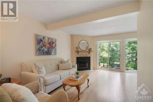 5 Saxton Private, Ottawa, ON - Indoor Photo Showing Living Room With Fireplace