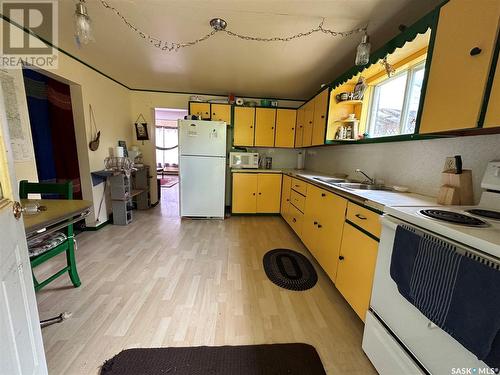 28 Oak Bay, Round Lake, SK - Indoor Photo Showing Kitchen With Double Sink