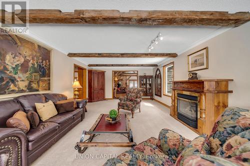 3135 Theatre Road N, Hamilton Township, ON - Indoor Photo Showing Living Room With Fireplace