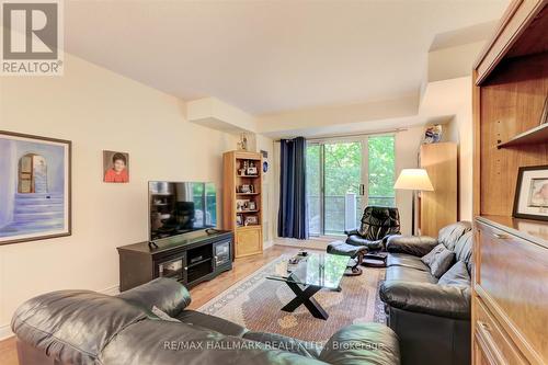 407 - 2 Aberfoyle Crescent, Toronto (Islington-City Centre West), ON - Indoor Photo Showing Living Room With Fireplace