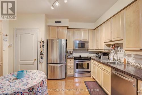 407 - 2 Aberfoyle Crescent, Toronto (Islington-City Centre West), ON - Indoor Photo Showing Kitchen With Double Sink