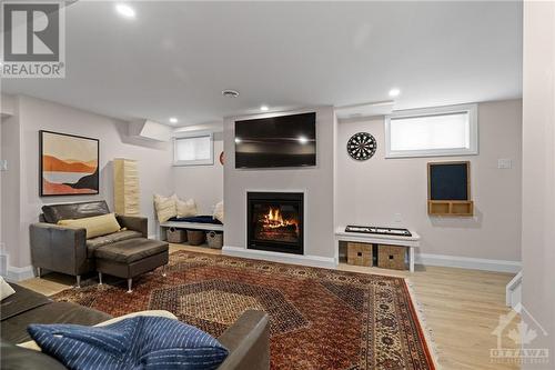 Cozy fireplace and benches. - 726 Borthwick Avenue, Ottawa, ON - Indoor With Fireplace