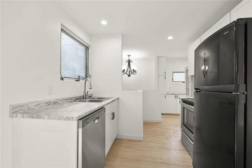 905 Beach Avenue, Winnipeg, MB - Indoor Photo Showing Kitchen With Double Sink