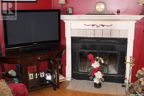 47 Bantry Street, Lanigan, SK - Indoor Photo Showing Living Room With Fireplace