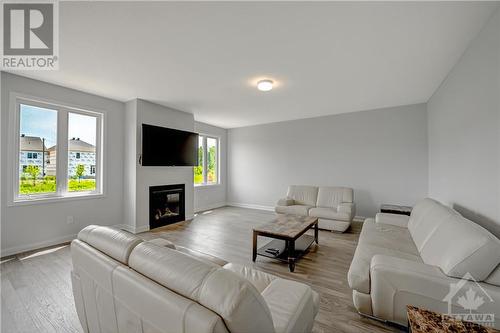 Family room - 182 Yearling Circle, Ottawa, ON - Indoor Photo Showing Living Room With Fireplace