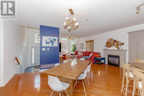 1102 Siesta Drive, Tiny, ON - Indoor Photo Showing Dining Room With Fireplace