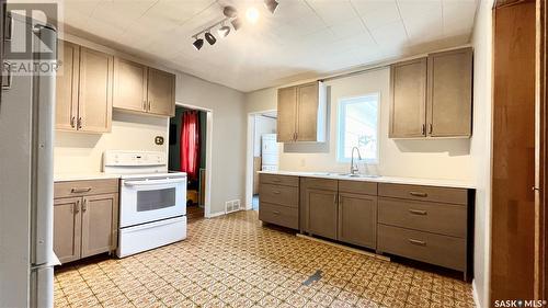 207 1St Street E, Meath Park, SK - Indoor Photo Showing Kitchen With Double Sink