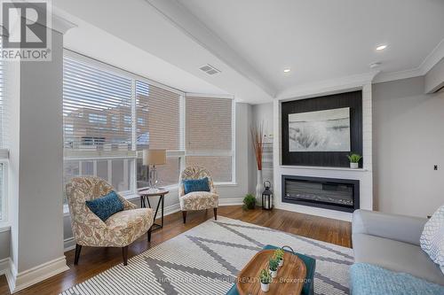 205 - 14924 Yonge Street, Aurora (Aurora Highlands), ON - Indoor Photo Showing Living Room With Fireplace