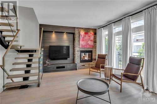 100 Tay Street, Ottawa, ON - Indoor Photo Showing Living Room With Fireplace