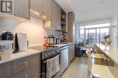 301 - 50 George Butchart Drive, Toronto, ON - Indoor Photo Showing Kitchen