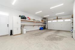 Garage view facing driveway with side entry access - 